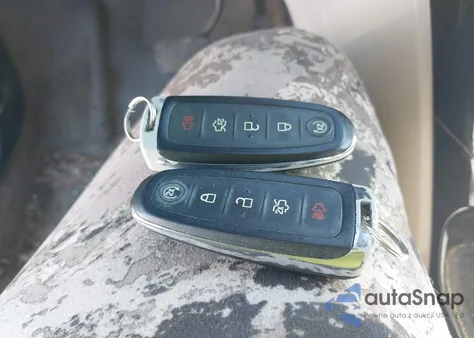 2014 Ford Escape Titanium z USA, uszkodzony, nr VIN 1FMCU0J99EUD79087